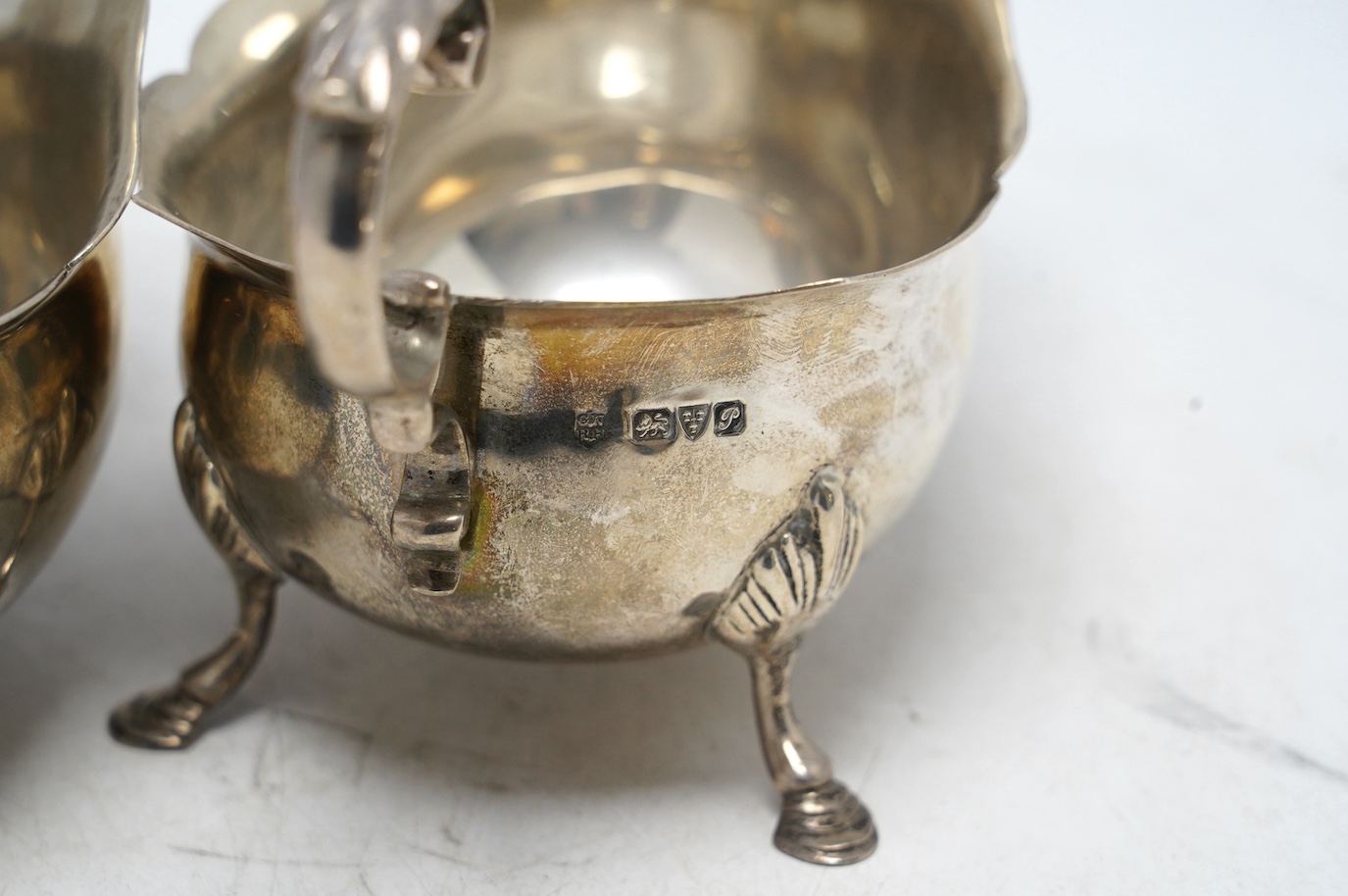 A pair of George V silver sauce boats, Nathan & Hayes, Chester, 1915, length 16.1cm, 12.6oz. Condition - fair